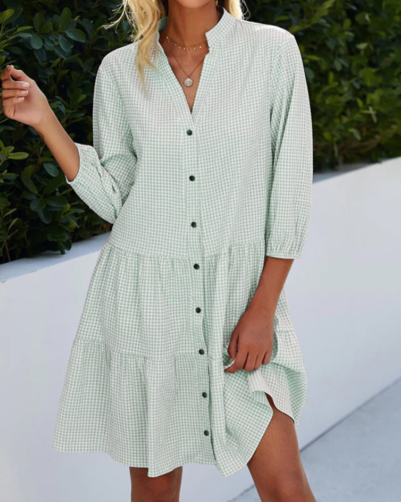 Elegant dress with a stand-up collar and plaid pattern
