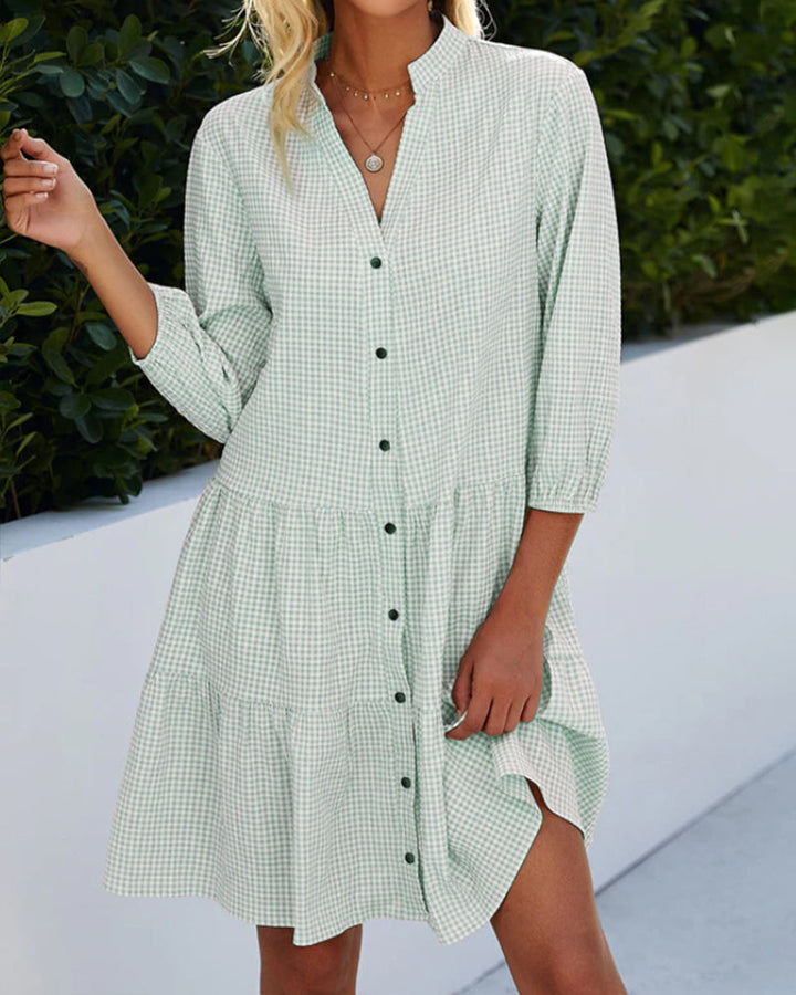 Elegant dress with a stand-up collar and plaid pattern