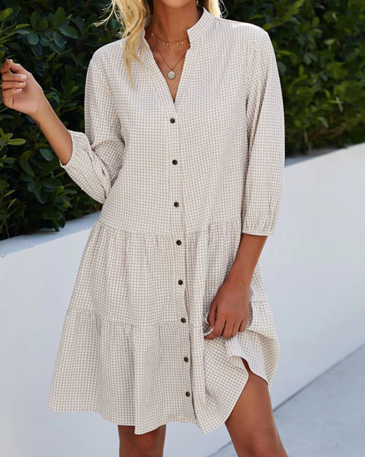 Elegant dress with a stand-up collar and plaid pattern