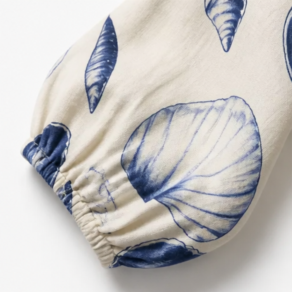 Shellini™ – Coastal Shell Print Wrap Romper