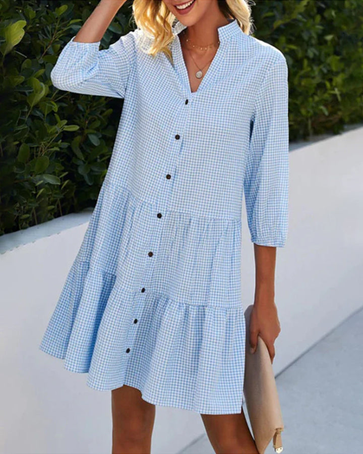 Elegant dress with a stand-up collar and plaid pattern