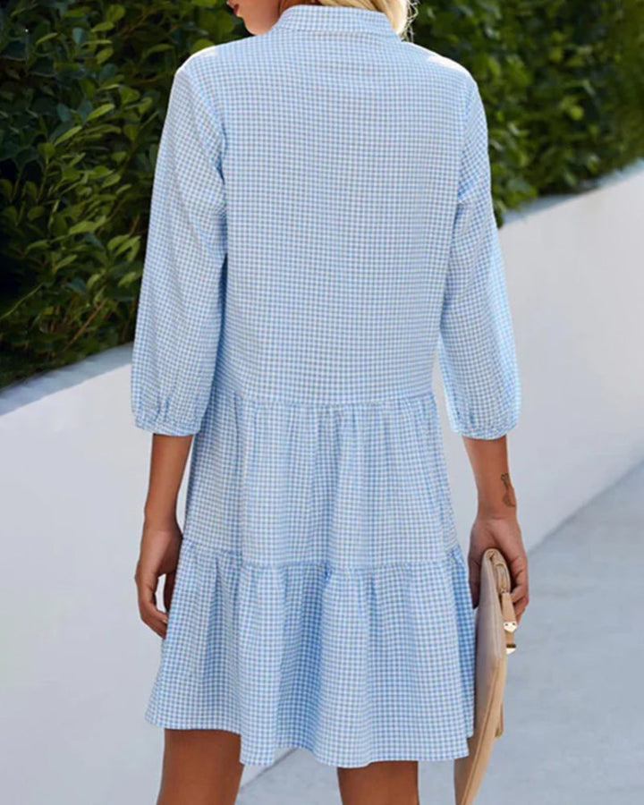 Elegant dress with a stand-up collar and plaid pattern