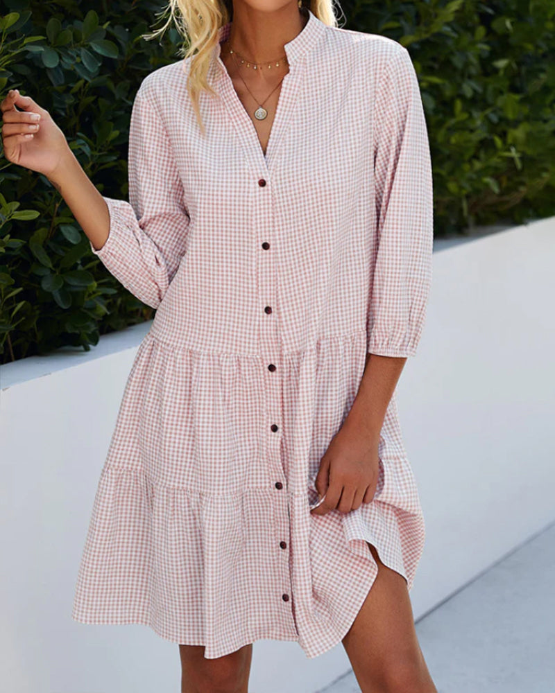 Elegant dress with a stand-up collar and plaid pattern
